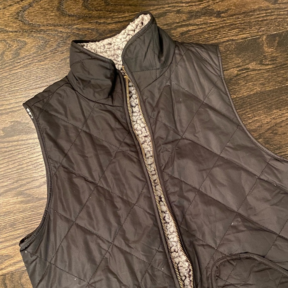 black and fluffy reversible vest